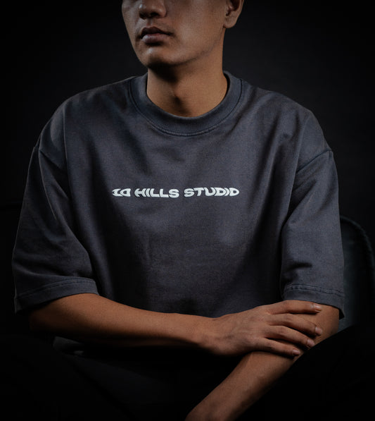 Model wearing the 10 Hills Studio Vintage Black Logo Tee