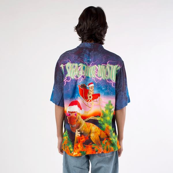 Back view of model wearing A Skating Monk Cats Fly On Christmas Shirt