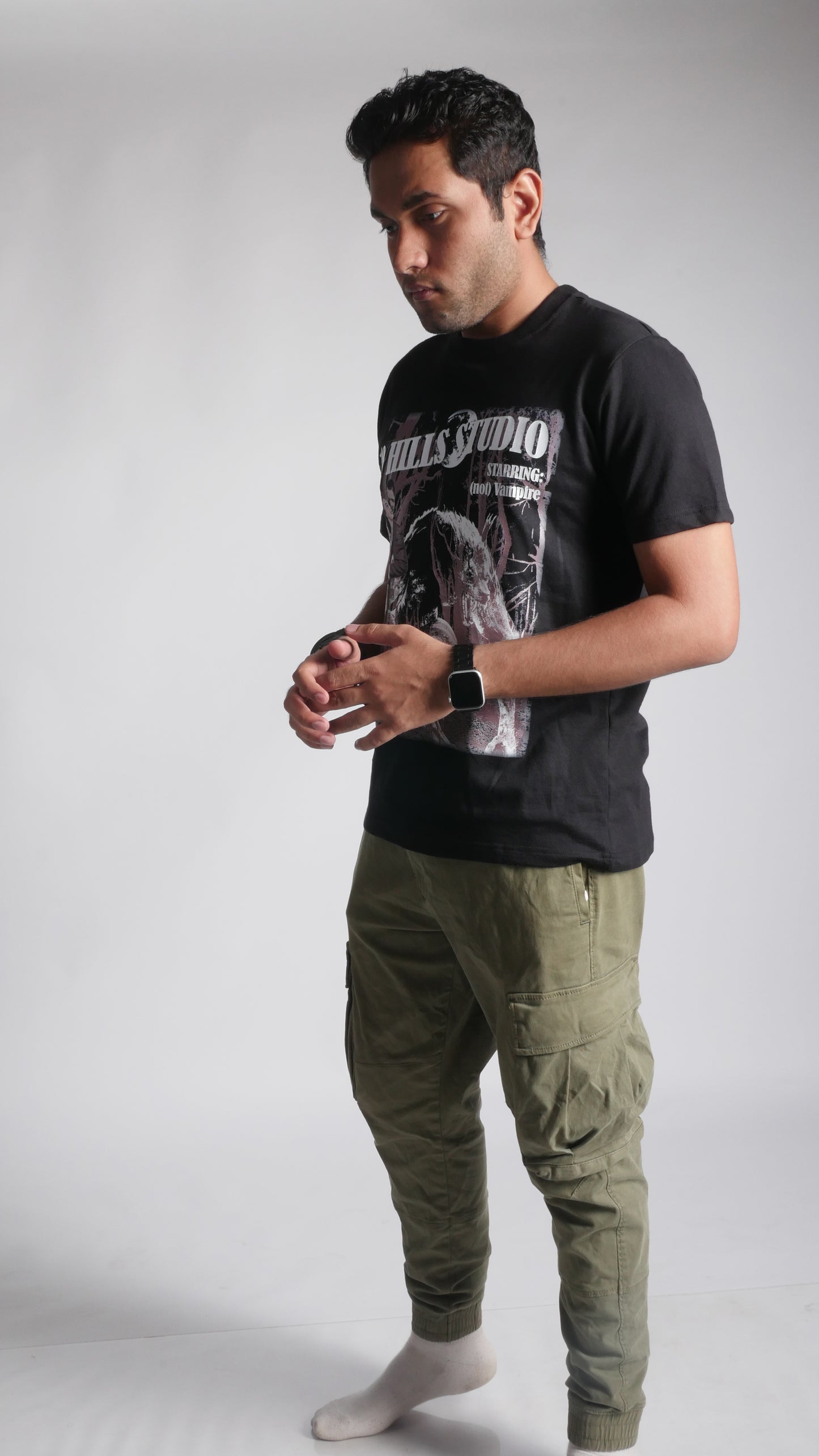 Front view of model wearing 10 Hills Studio Unisex 'Stop War' Black Boxy T-shirt against a white background, facing slightly left
