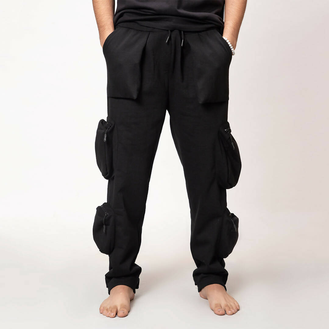 Model wearing black heavyweight utility cargo pants by WalaWali