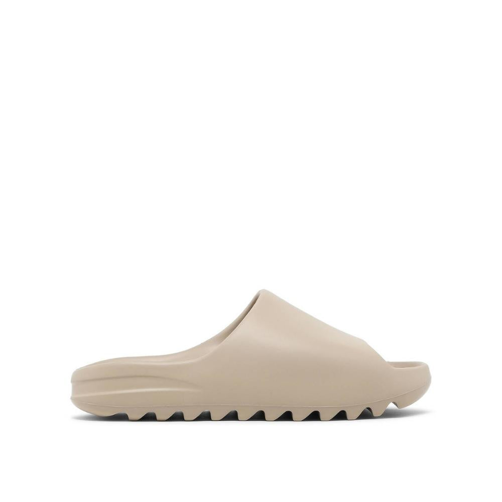 side view of Adidas Yeezy Slides Pure; right pair