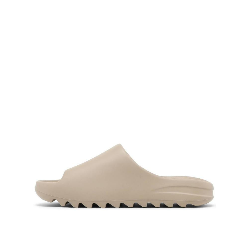 side view of Adidas Yeezy Slides Pure; left pair