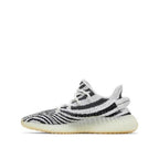 side view of Adidas Yeezy 350 v2 Zebra; left pair