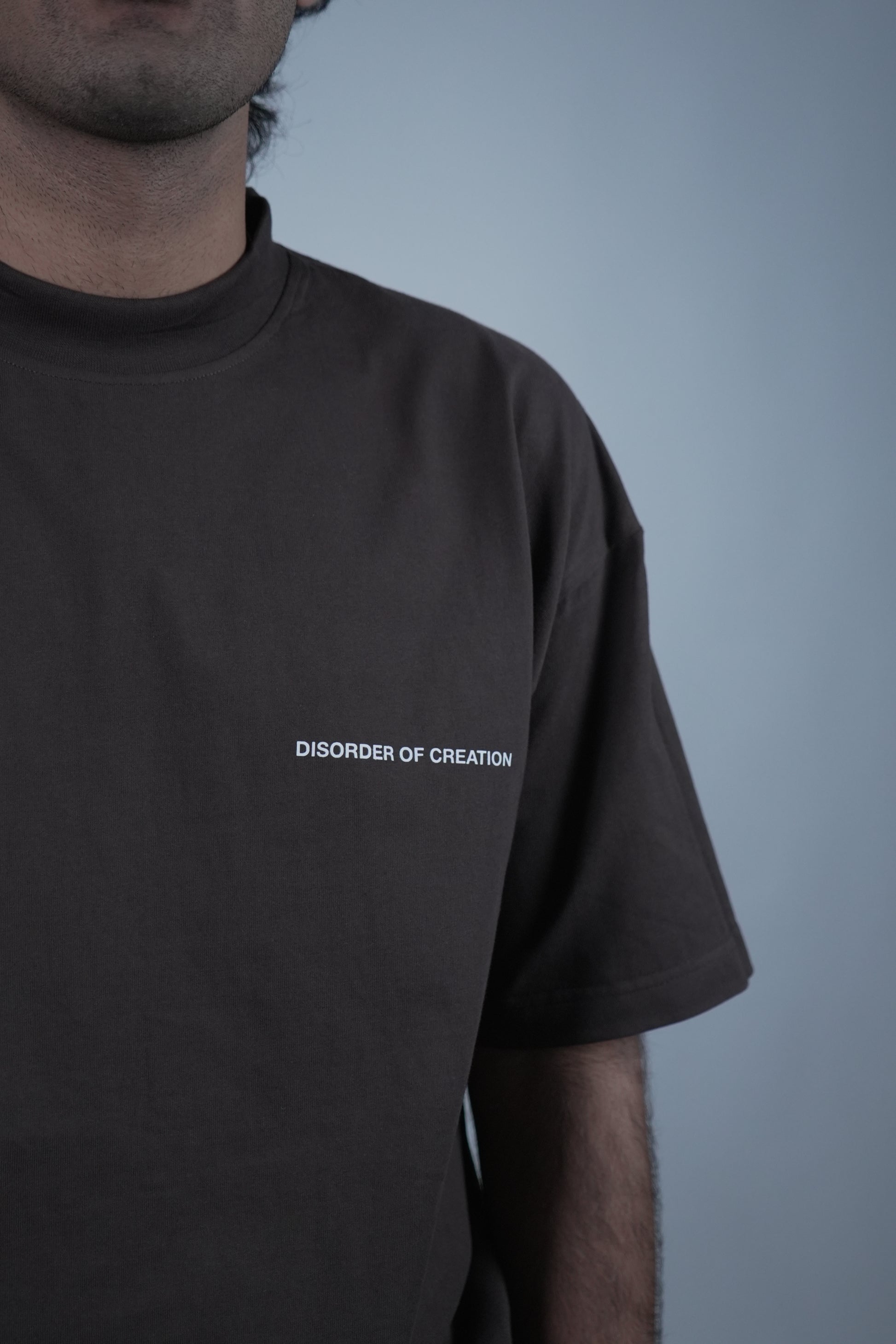 Close-up of the 'Prisoner of Mind' T-shirt by Disorder of Creation, featuring logo on the left chest