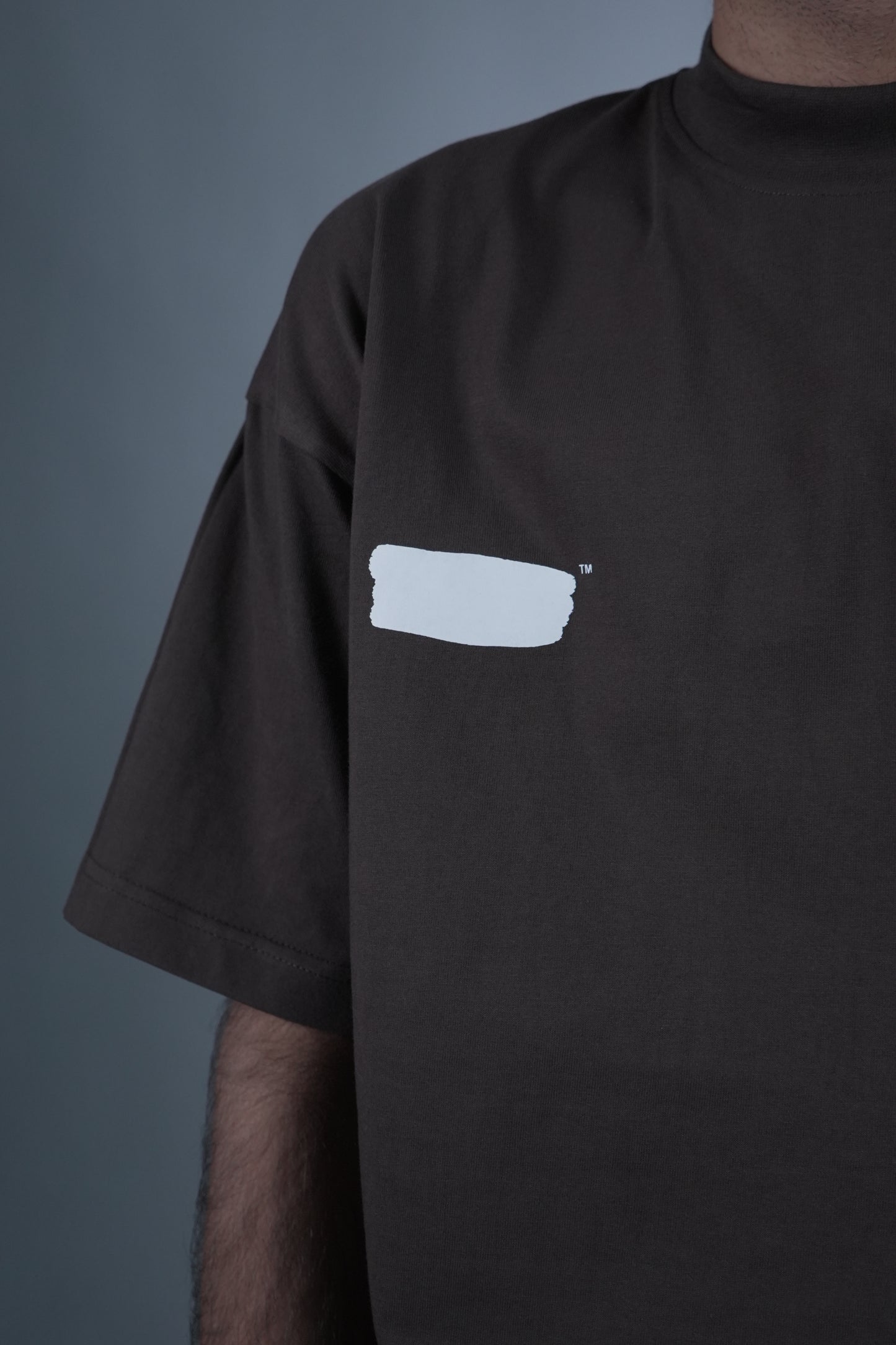 Close-up of the 'Prisoner of Mind' T-shirt by Disorder of Creation, featuring a white rectangular logo on the right chest