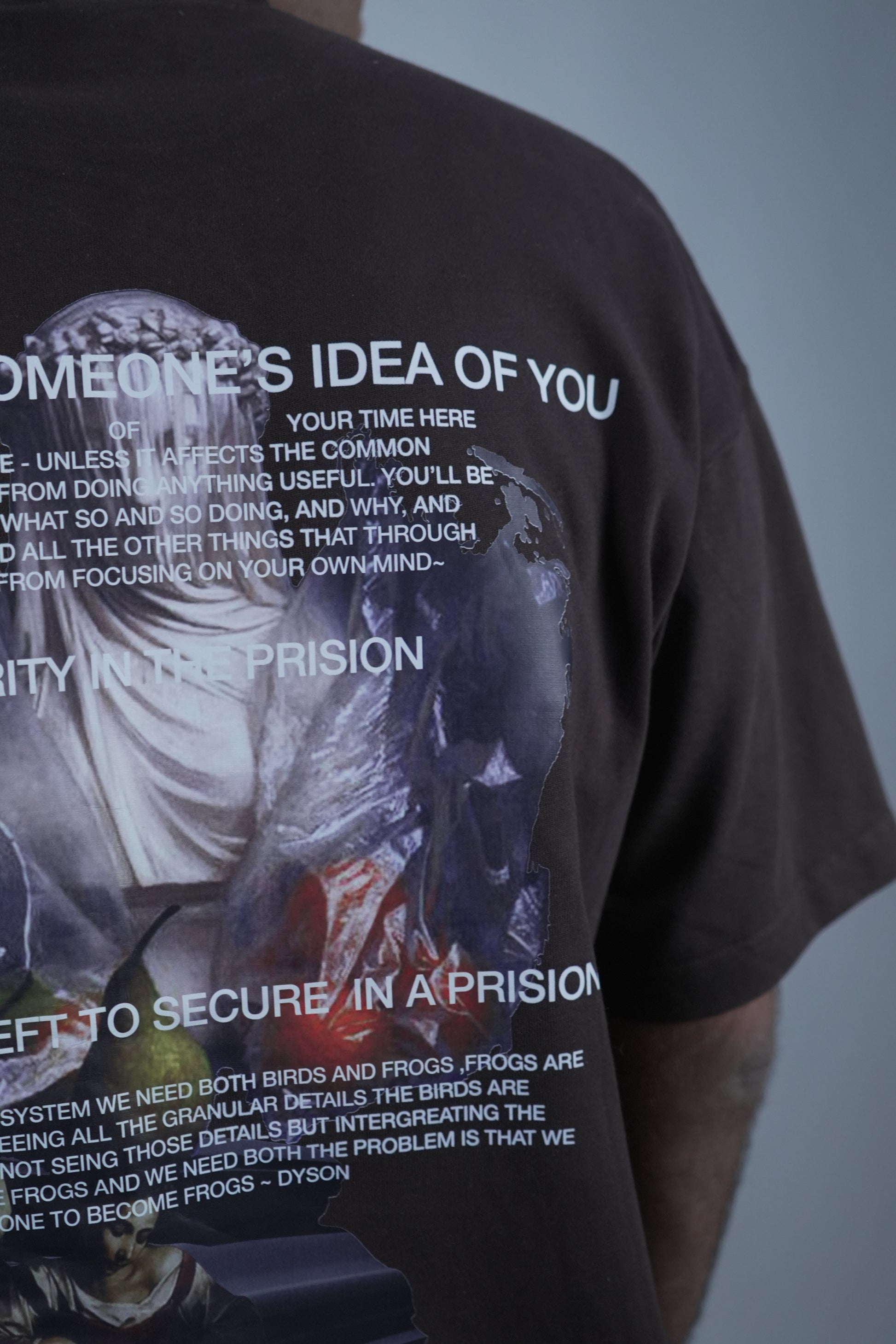 Close-up of the 'Prisoner of Mind' T-shirt by Disorder of Creation, viewed from the back showcasing graphic print on the back
