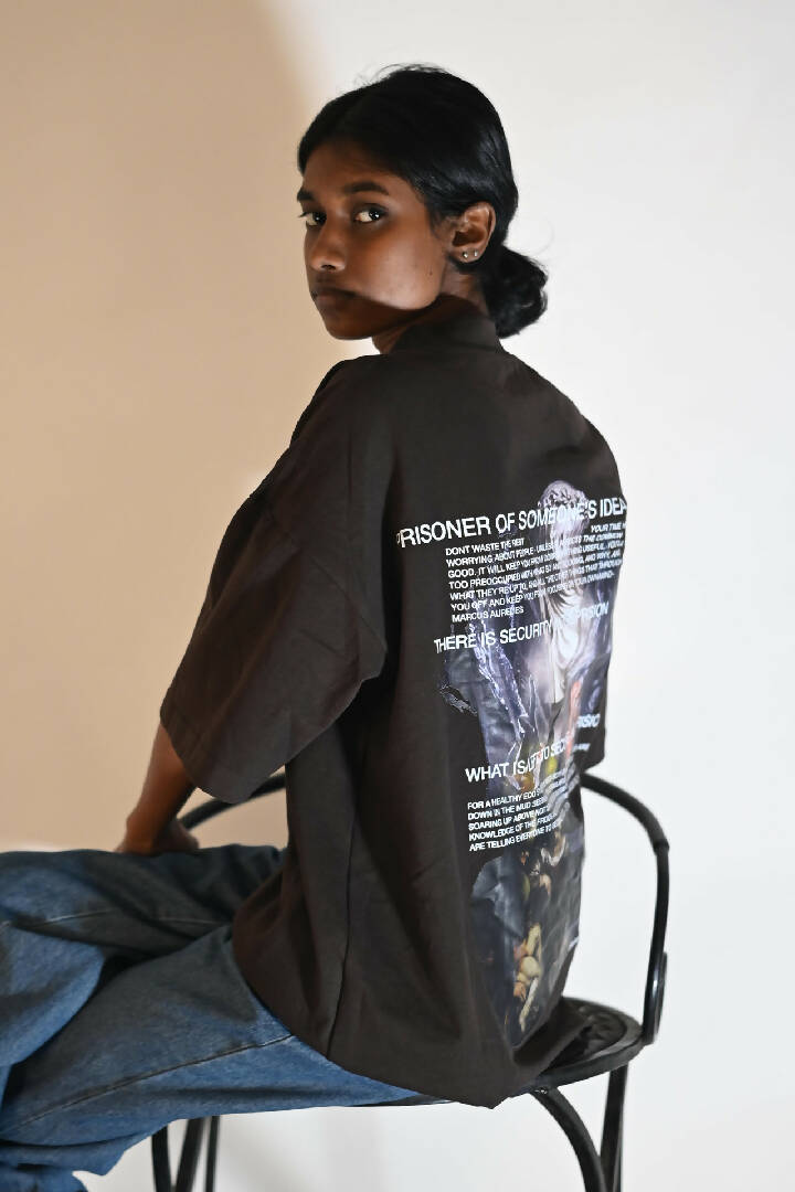 Female model wearing 'Prisoner of Mind' graphic T-Shirt, viewed from the back 2