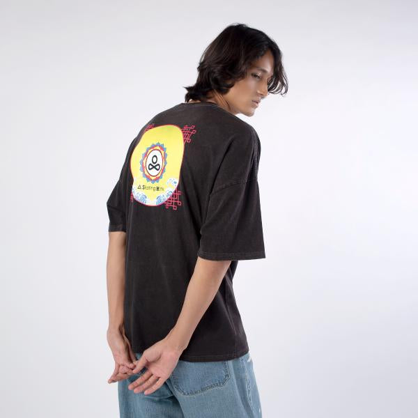 Back view of male model wearing A Skating Monk Black 'Reborn' Oversize Tee