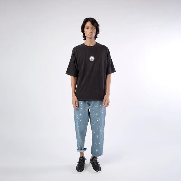 Front view of male model wearing A Skating Monk Black 'Reborn' Oversize Tee
