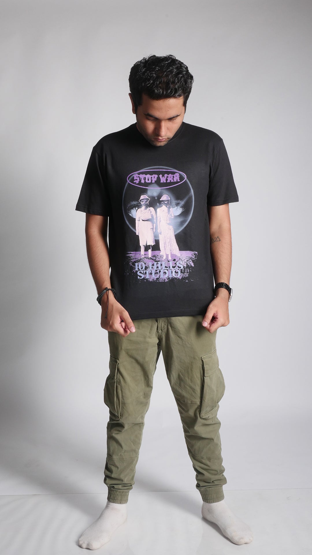 Front view of model wearing 10 Hills Studio Unisex 'Stop War' Black Boxy T-shirt